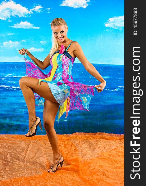 Dancing woman on the sea background