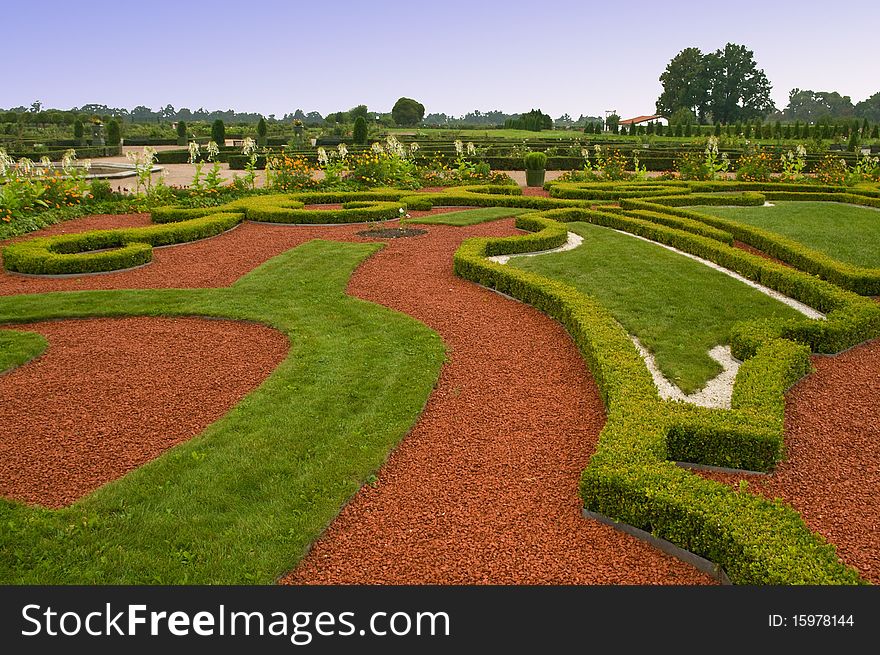 Avenue and ber or flowers in formal garden. Avenue and ber or flowers in formal garden
