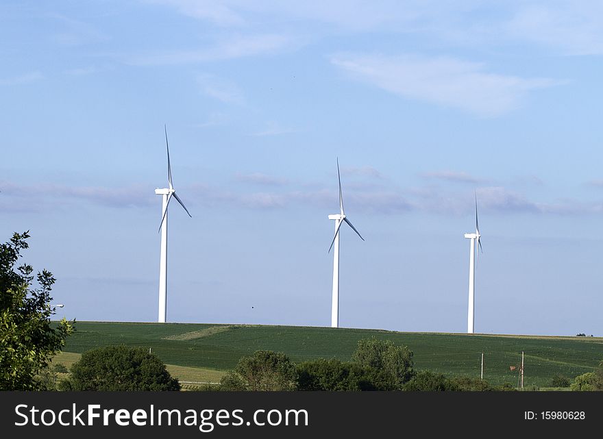 Windmill farm in the breezy hills of Iowa. Windmill farm in the breezy hills of Iowa