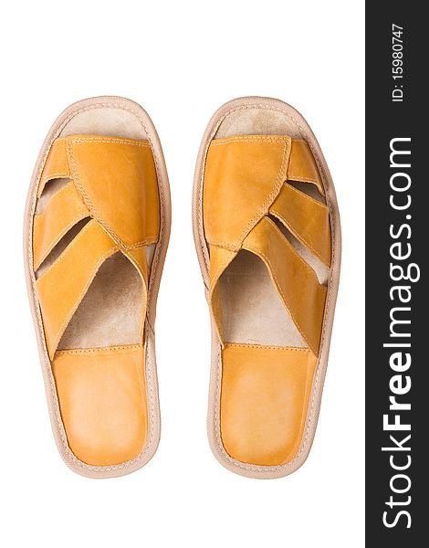 Isolated yellow leather comfortable slippers, home shoes