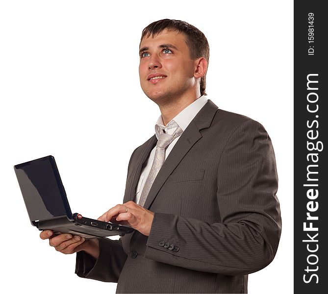 Happy young businessman using laptop. Happy young businessman using laptop