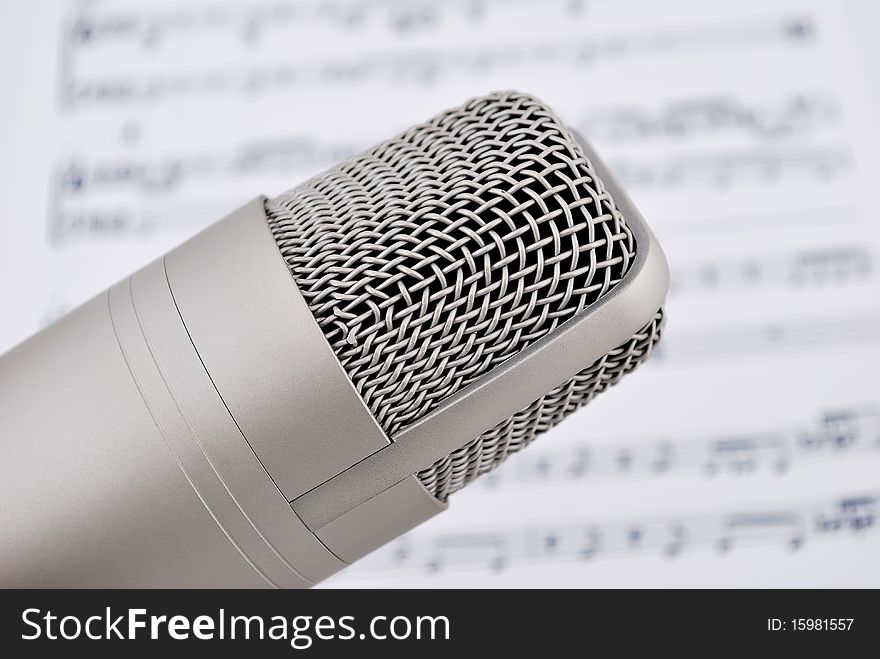 Professional microphone and musical notes. Professional microphone and musical notes