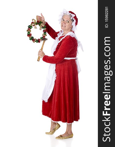 Mrs. Santa Claus with a hammer in hand, preparing to hang a jingle-bell wreath.  Isolated on white. Mrs. Santa Claus with a hammer in hand, preparing to hang a jingle-bell wreath.  Isolated on white.