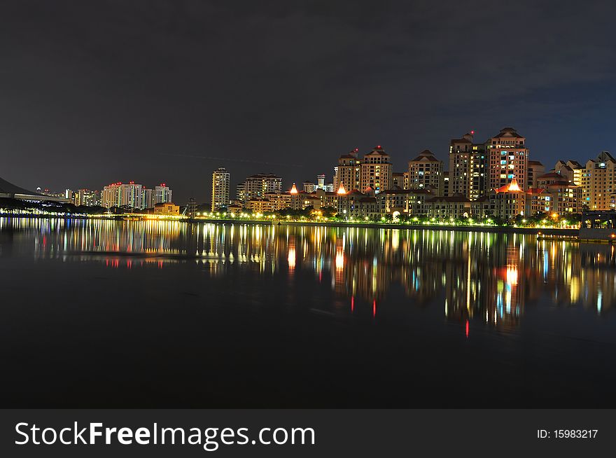 Apartments with colourful light reflection by Kallang River. Apartments with colourful light reflection by Kallang River