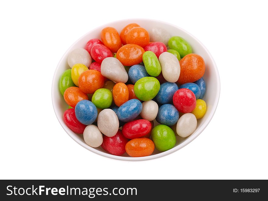 Multicolored sweets covered with glaze on a plate