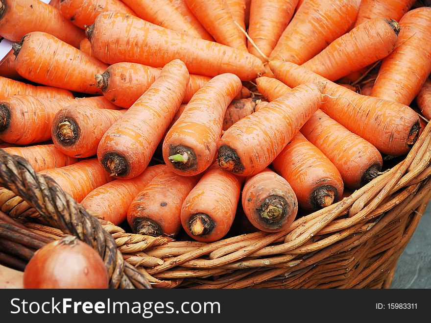 Photo of carrots crop in a basket