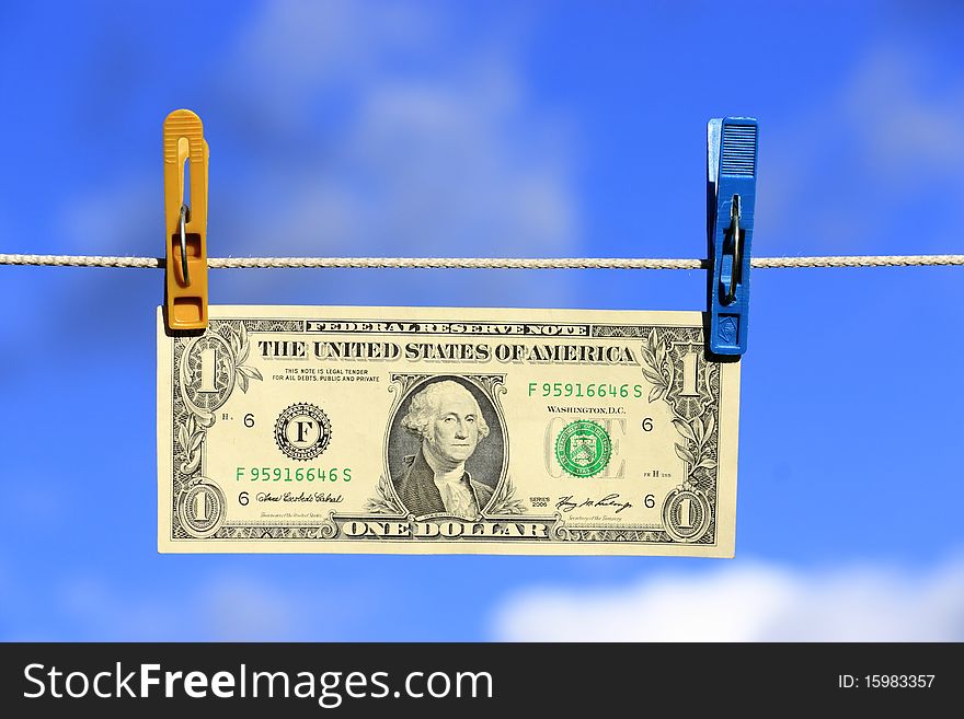 The American one dollar on a background of the sky