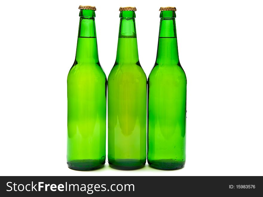 Three beer bottles on white background. Three beer bottles on white background.