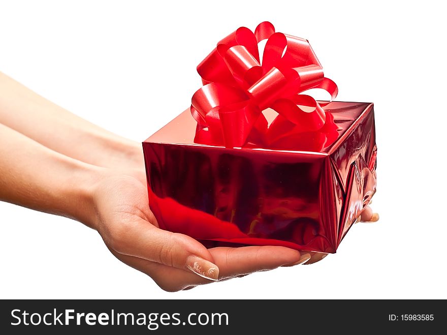 Female hands giving a christmas gift. Isolated on white. Female hands giving a christmas gift. Isolated on white