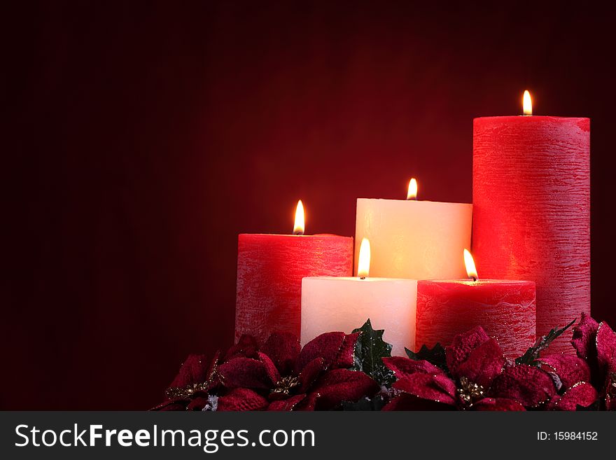 Burning Candles With Seasonal Decorations