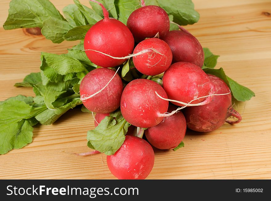 Red radish on a wooden table