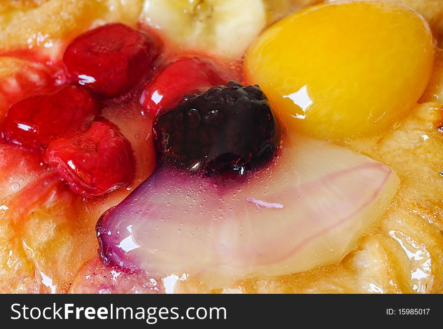 Fruitcake. cake with fruits like, pineapple, banana, raspberry, peach and blackberry