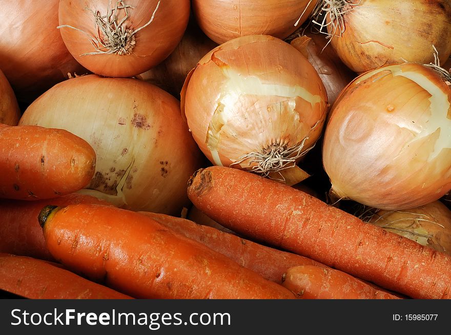 Carrots and onions side by side. Carrots and onions side by side