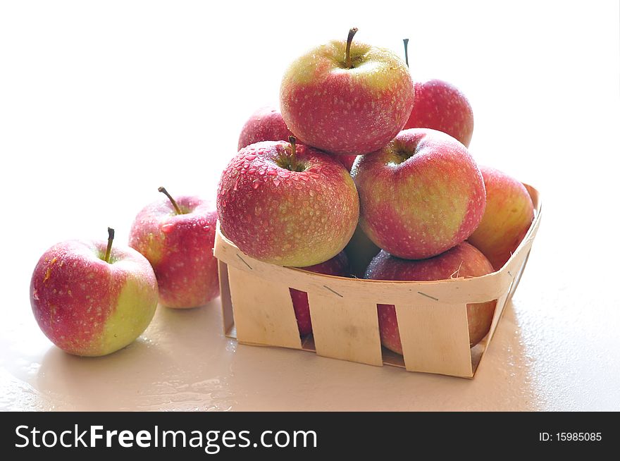 Fresh red apples with drops of water