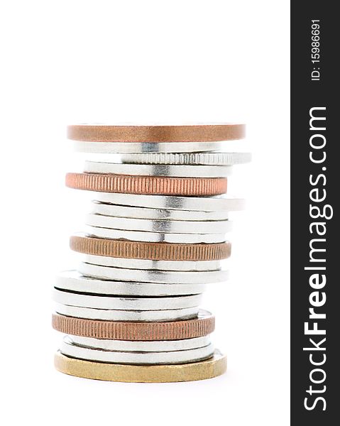 A stack of silver and bronze coins isolated on white. A stack of silver and bronze coins isolated on white