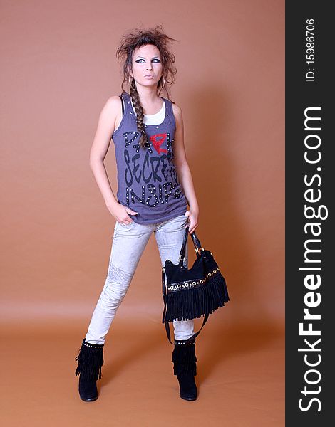 Portrait of urban fashion stylish model with handbag