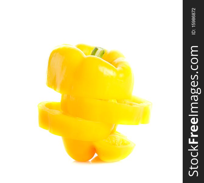 Yellow bell pepper cut and rearranged again isolated on white with copy space. Yellow bell pepper cut and rearranged again isolated on white with copy space