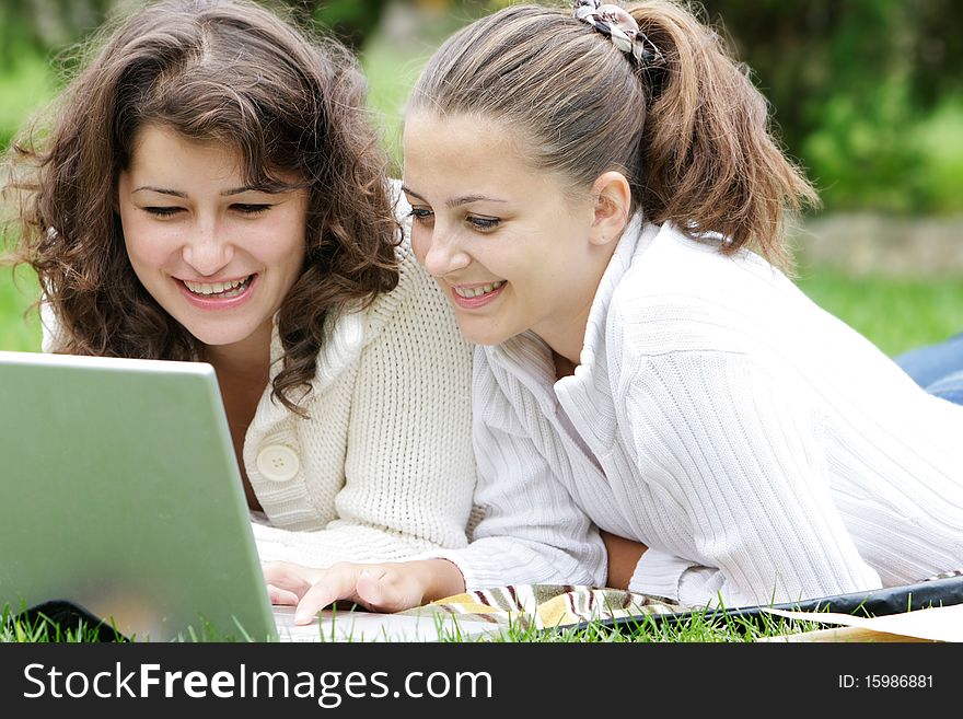 Two student girls on natural background. Two student girls on natural background