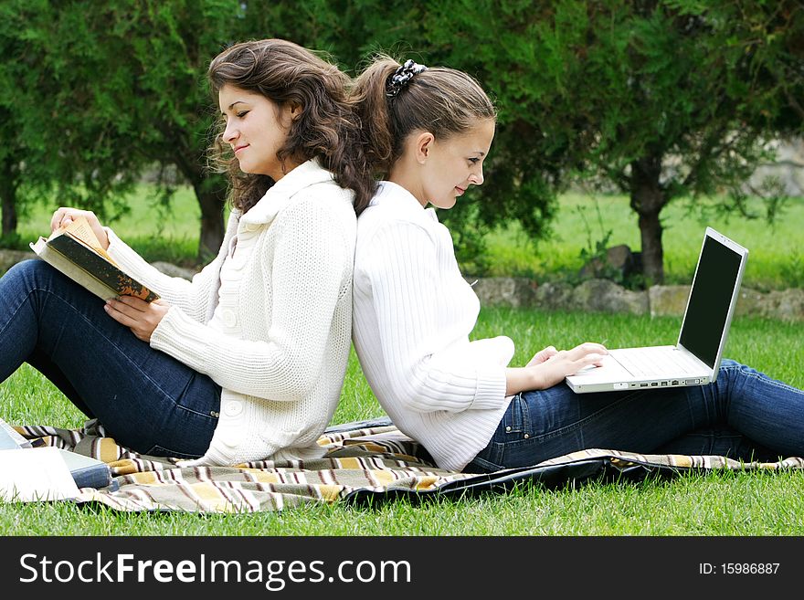 Two student girls on natural background. Two student girls on natural background