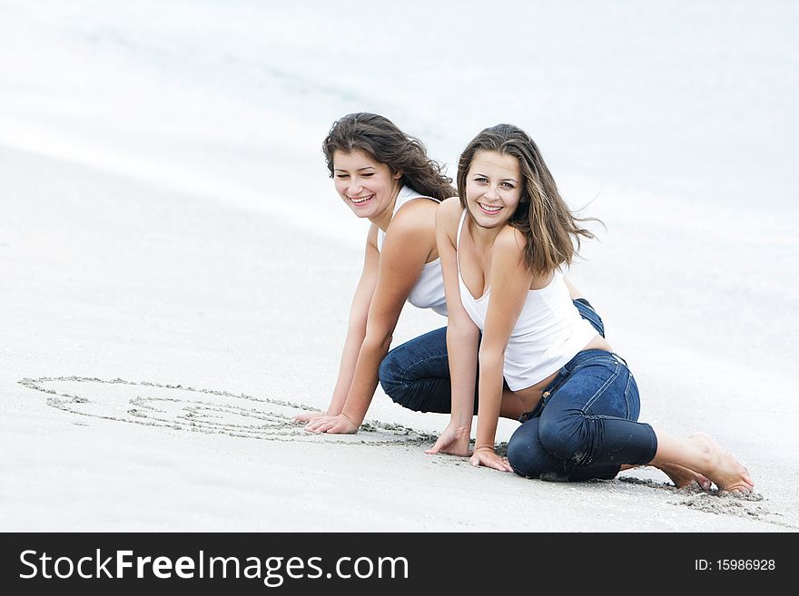 Two Happy Girls On Beach