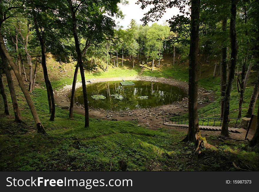 The Kaali meteorite crater, Saaremaa island, Estonia. The most unique geological object of Estonia - Kaali lake (110 m in diameter and 22 m in depth). The analysis of the fragments showed that the cosmic body belonged to the most frequent type of iron meteorite.