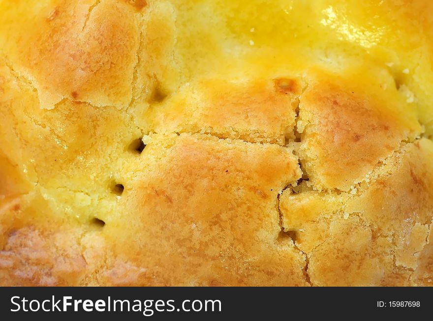 Closeup of golden brown pie texture. For concepts such as food and beverage, diet and nutrition, and healthy eating. Closeup of golden brown pie texture. For concepts such as food and beverage, diet and nutrition, and healthy eating.