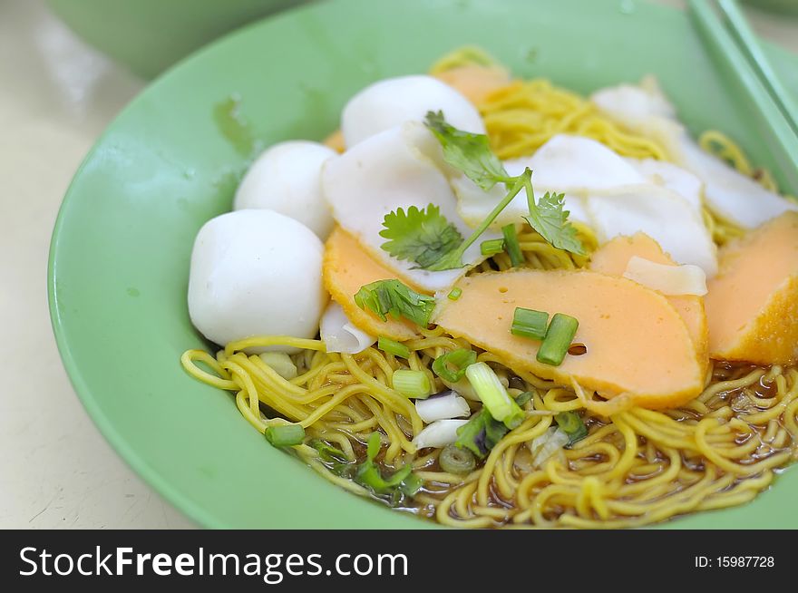 Delicious looking Chinese style fishball noodles. Suitable for concepts such as food and beverage, and travel and cuisine.
