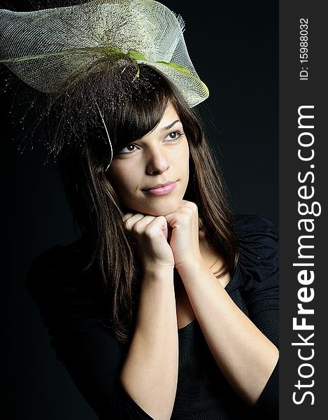 Elegant young woman portrait with hat and plants in hair. Elegant young woman portrait with hat and plants in hair