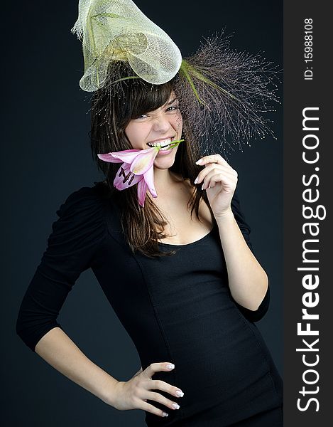 Elegant teenager girl posing with flower and hat. Elegant teenager girl posing with flower and hat