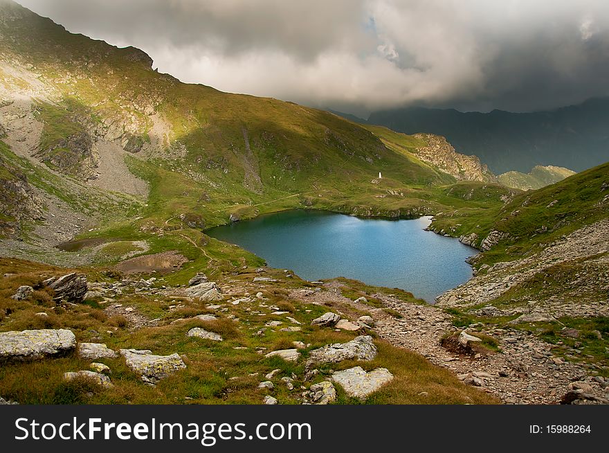 The alpine Goat Lake is situated in the southern Fagaras mountains, in Sibiu county, Romania . The alpine Goat Lake is situated in the southern Fagaras mountains, in Sibiu county, Romania
