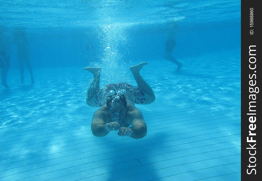 Swimming underwater photo of a men