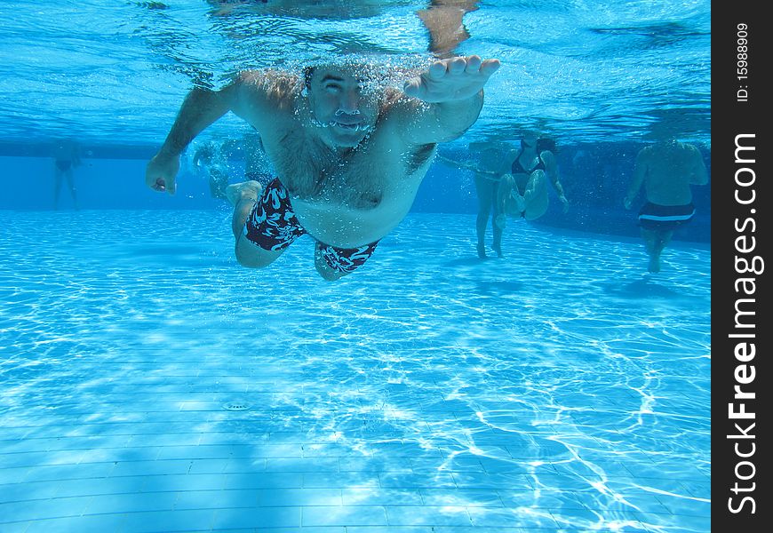 Swimming underwater photo of a men