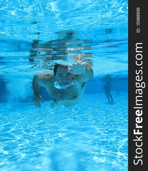 Swimming underwater photo of a men