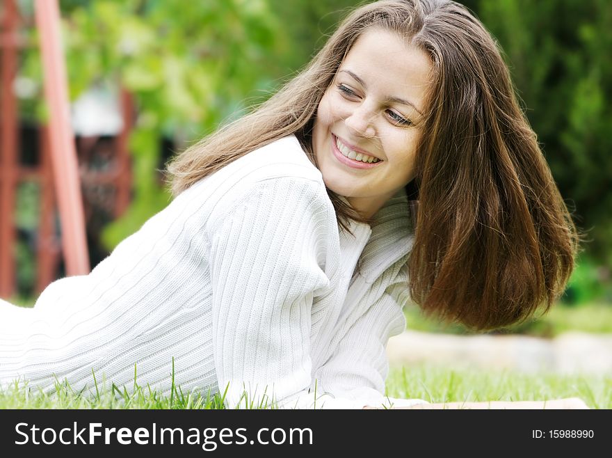 Smiling Girl On Natural Background