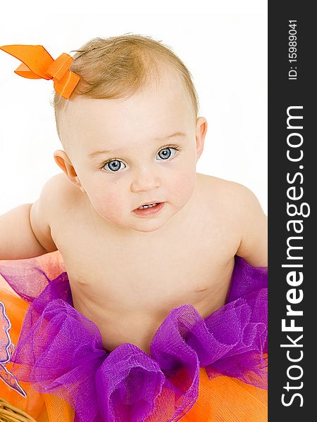 Cute baby girl with colorful bow and skirt isolated. Cute baby girl with colorful bow and skirt isolated