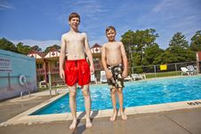 Brothers Having Fun At The Pool Stock Image