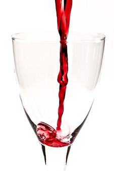 Red Wine Is Flowing Into The Wine Glass V1 Stock Images