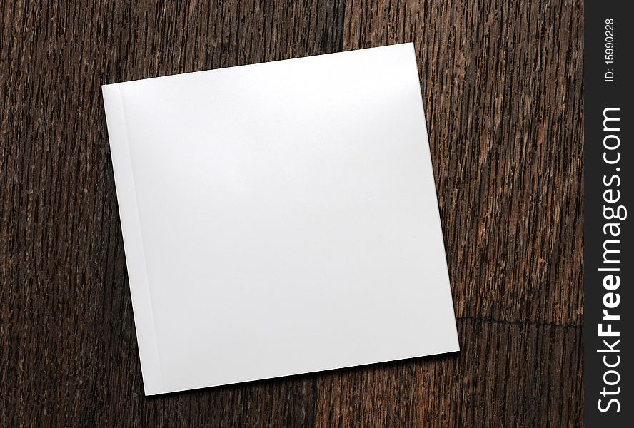White-book On A Wooden Background