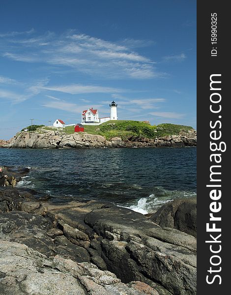 The Cape Neddick Nubble light house from a distance.