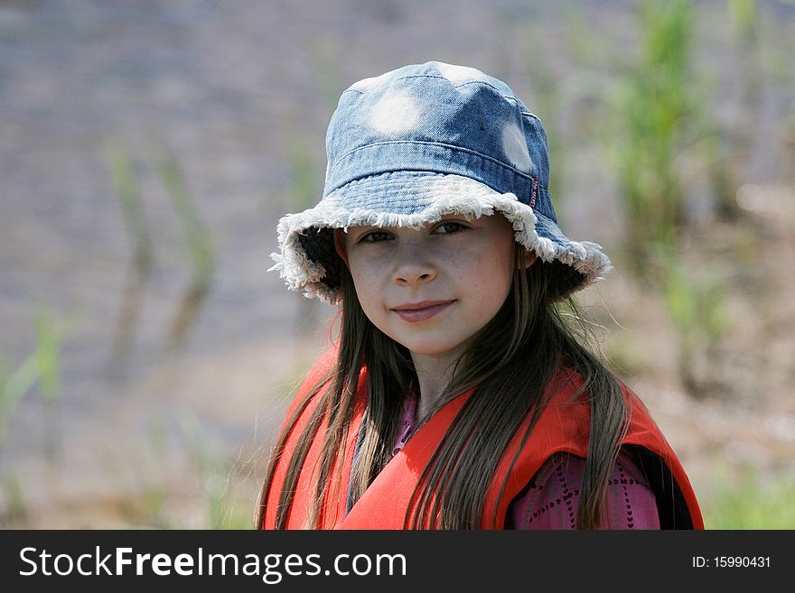 Nice, young girl with hat enjoy summer time. Nice, young girl with hat enjoy summer time.