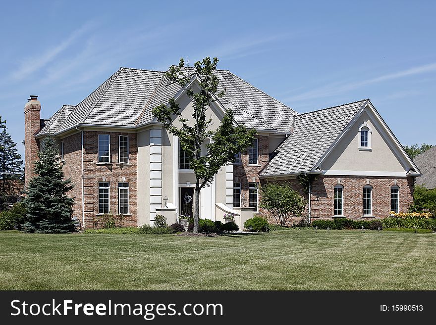 Large brick home with cedar shake roof. Large brick home with cedar shake roof