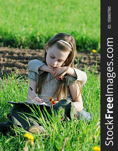 Girl enjoy summer time in the green grass. Girl enjoy summer time in the green grass.