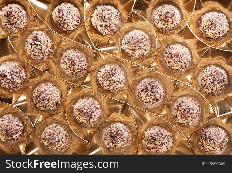 Chocolate sweets in packing from a golden foil