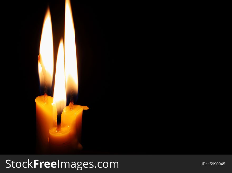 Candles on the black background. Candles on the black background