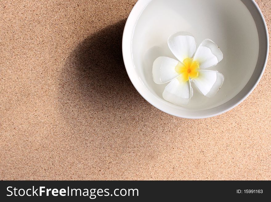 Aromatherapy bowl with frangipani flower float on water. Aromatherapy bowl with frangipani flower float on water