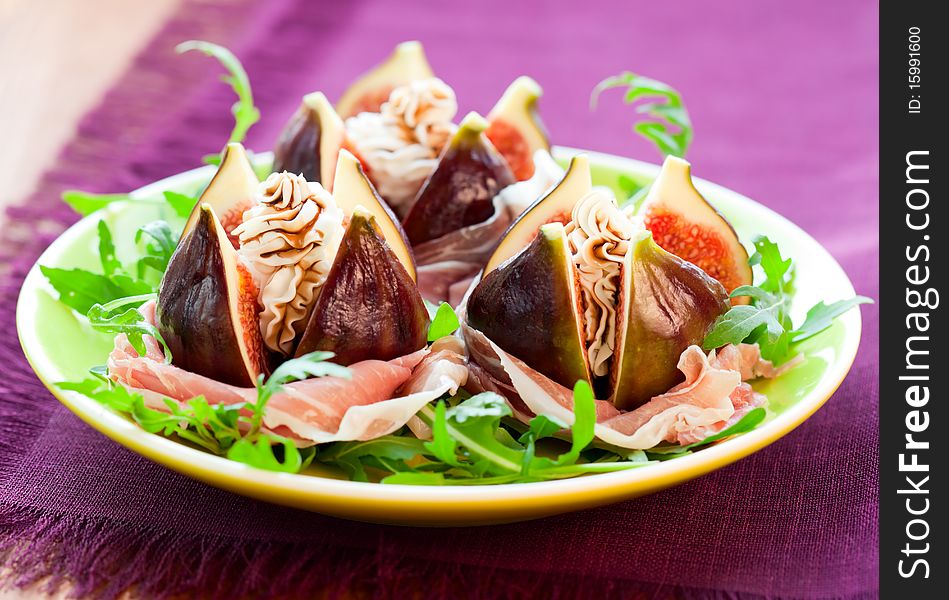 Salad with fresh figs, cheese,prosciutto,rocket  and balsamic. Salad with fresh figs, cheese,prosciutto,rocket  and balsamic