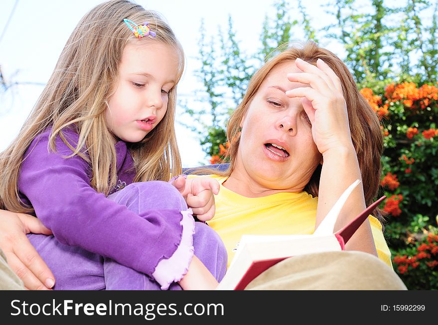 Mother And Daughter Reading A Book