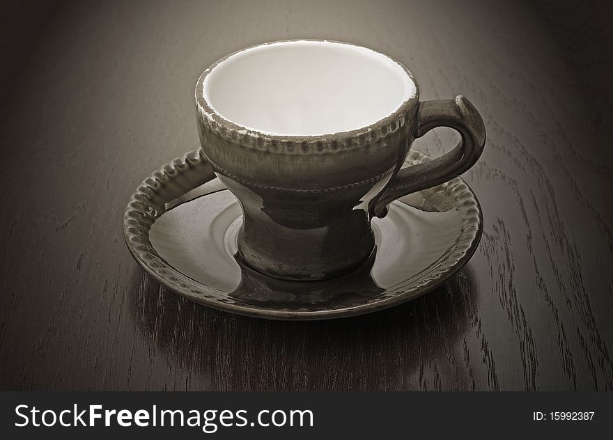 Vintage coffee cup on wooden table