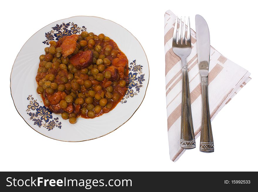 Cooked peas with bacon and carrots isolated on white background with clipping path. Cooked peas with bacon and carrots isolated on white background with clipping path