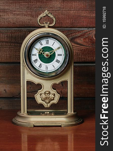 Old antique Clock on wooden background. Old antique Clock on wooden background